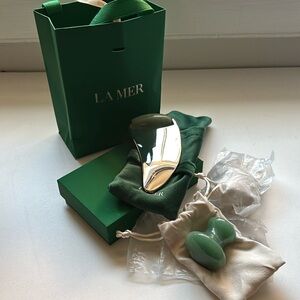 Collection of three La Mer facial massage tools